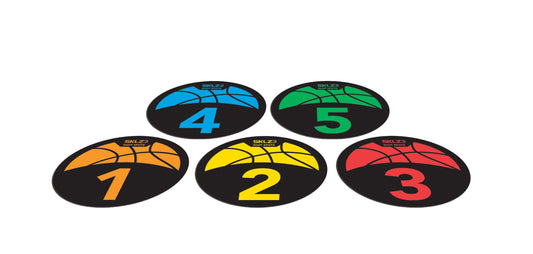 Colored game pieces are arranged on a white surface numbered from one to five