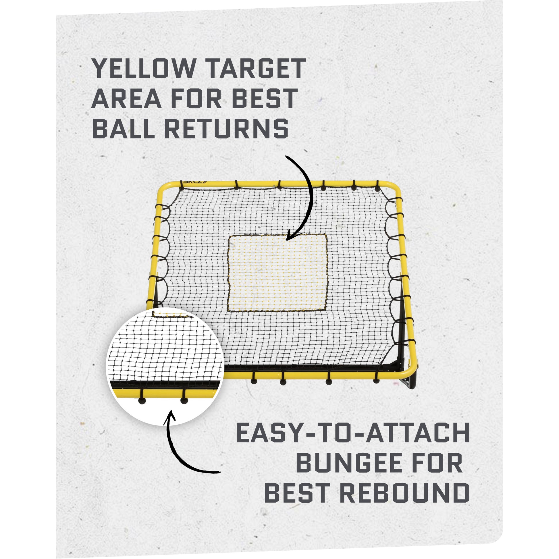 A square net with a yellow border is set up in a gym for ball returns and rebounding practice.