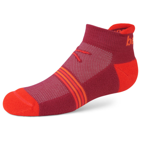 A sock displays a streamlined design in red and orange colors, resting on a plain white surface.