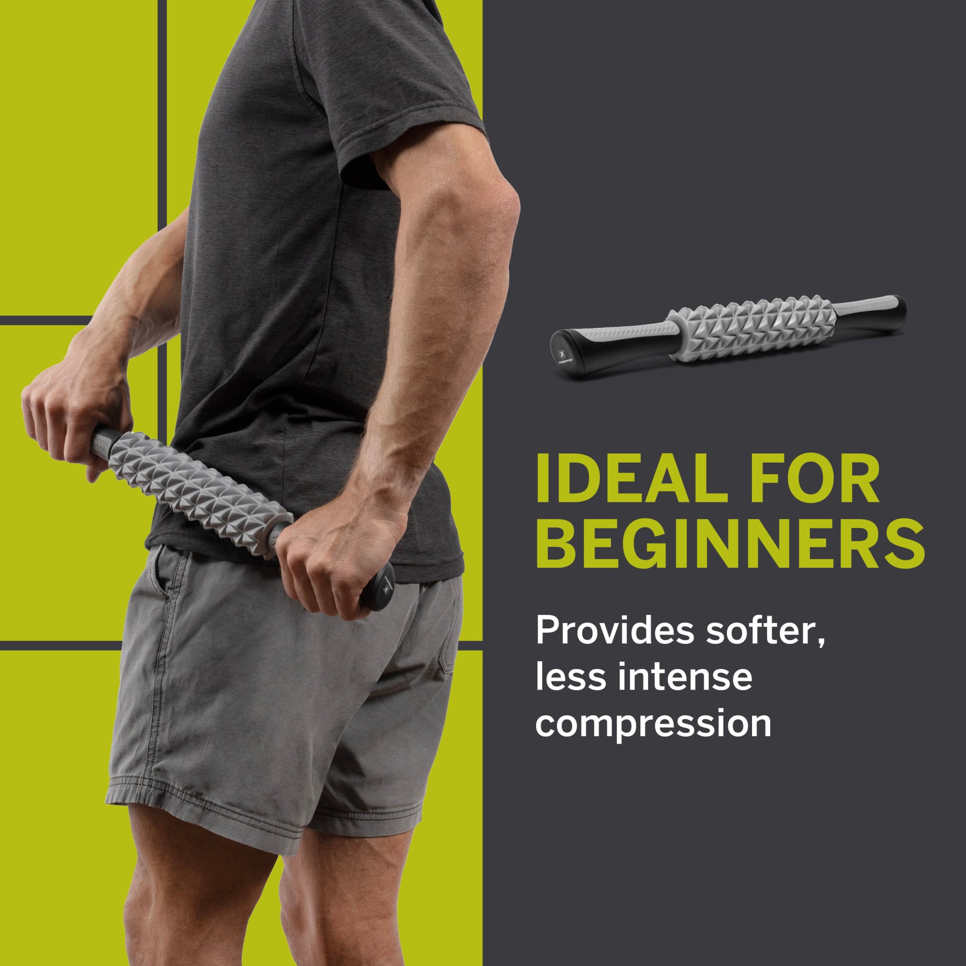 Person uses a massage roller on thigh, standing against a split green and gray background.