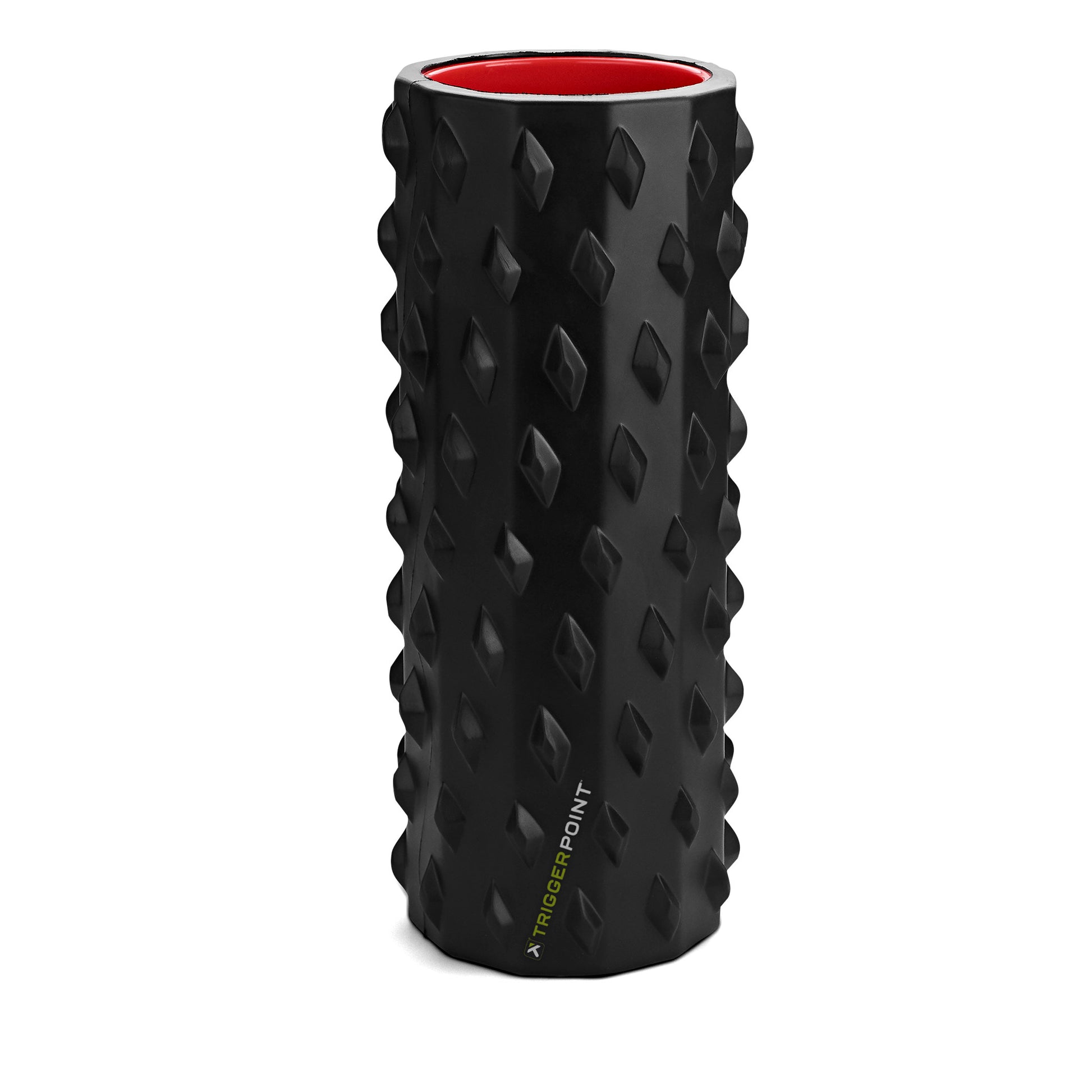 The foam roller rotates on a surface in a fitness equipment storage area.