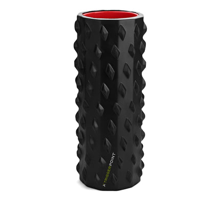 The foam roller rotates on a surface in a fitness equipment storage area.