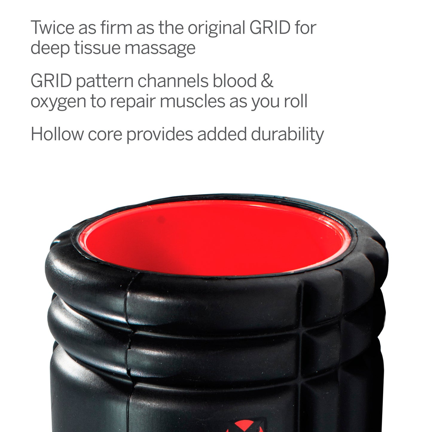 A black and red massage roller with a hollow core in a promotional display.