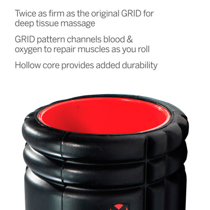 A black and red massage roller with a hollow core in a promotional display.
