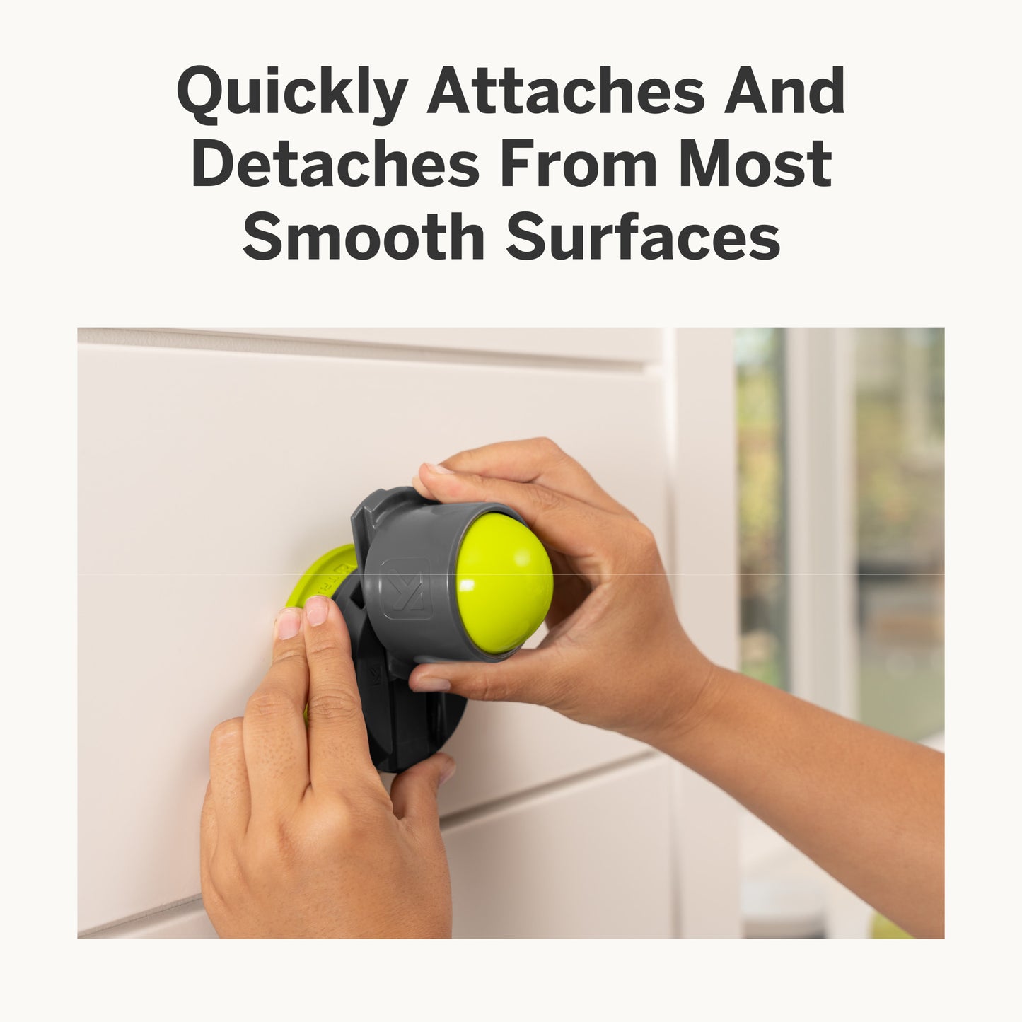 Hand attaches or detaches a cleaning tool from a smooth surface wall.