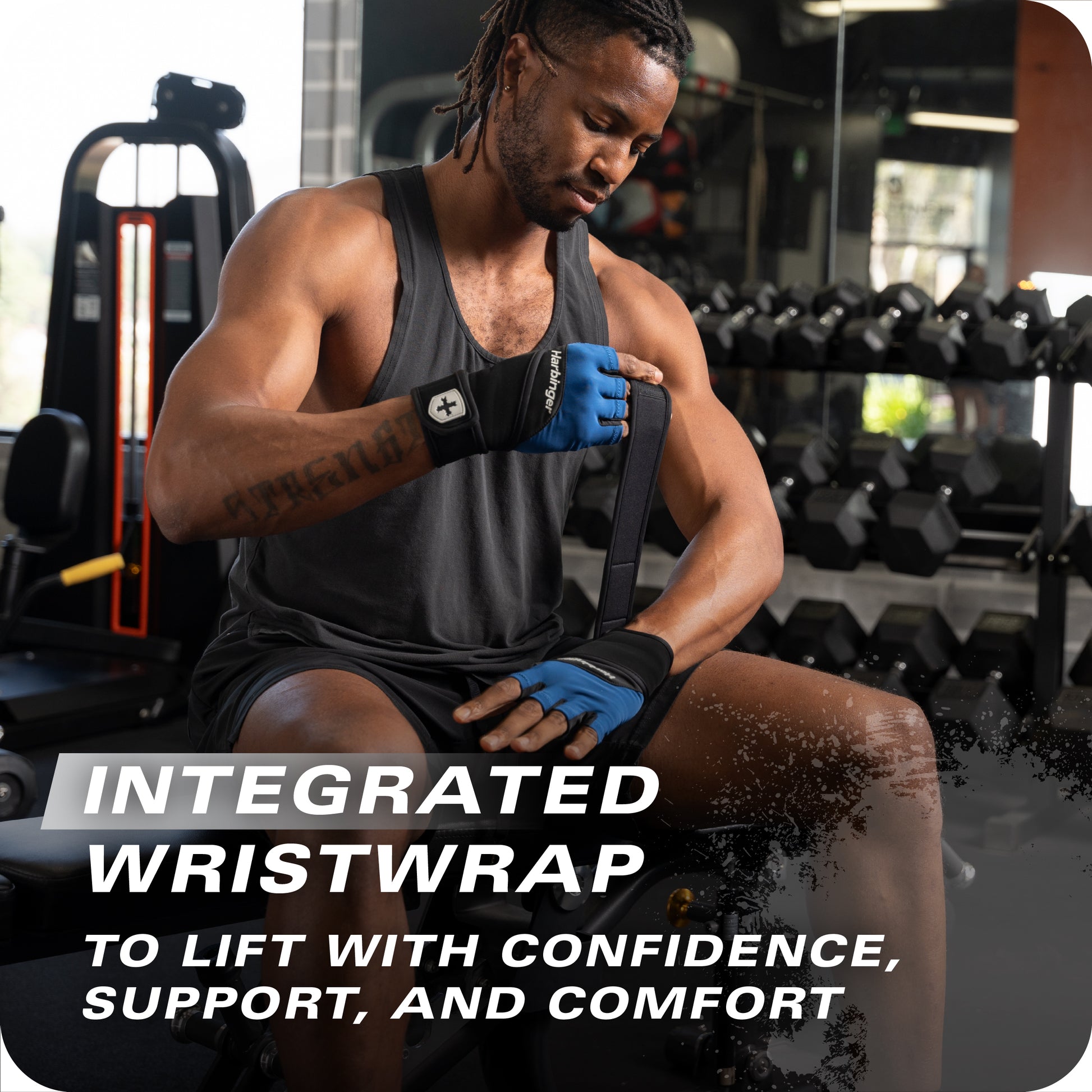 Man wraps wrist with integrated wristwrap in a gym for support and confidence.