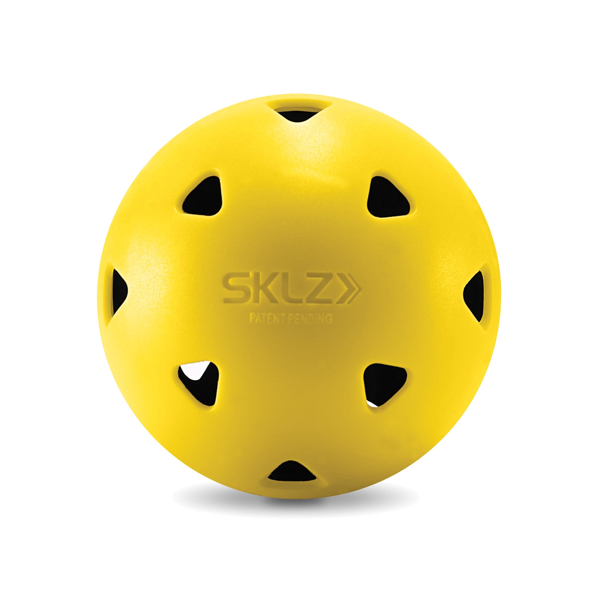 A yellow sports ball with multiple black ventilation holes on a white background