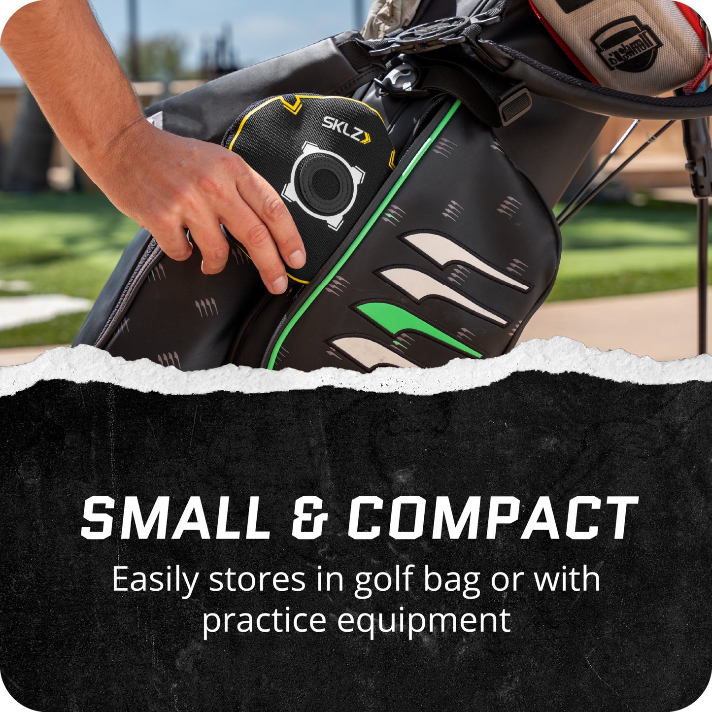 A golf bag displays a small golf speaker stored inside in an outdoor setting