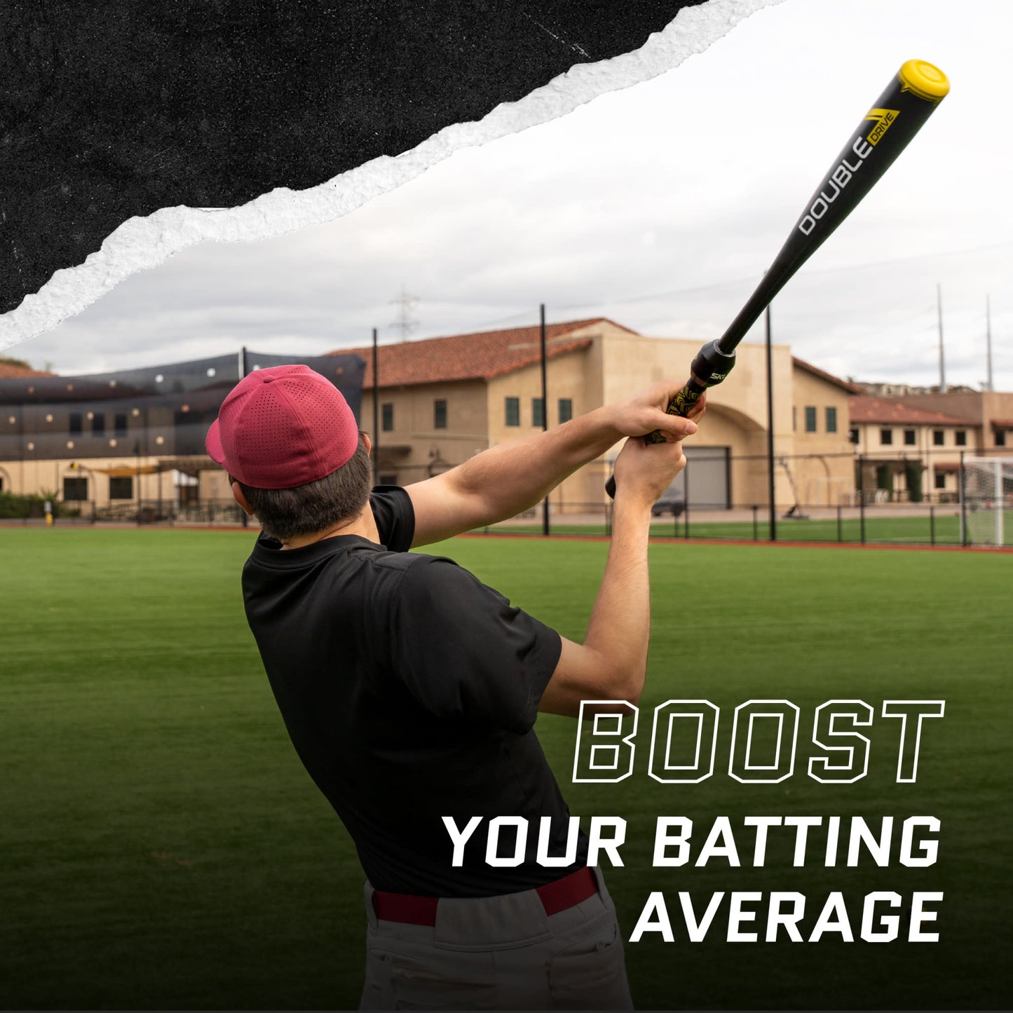 Person swings bat at baseball field with buildings in background promoting improving batting average