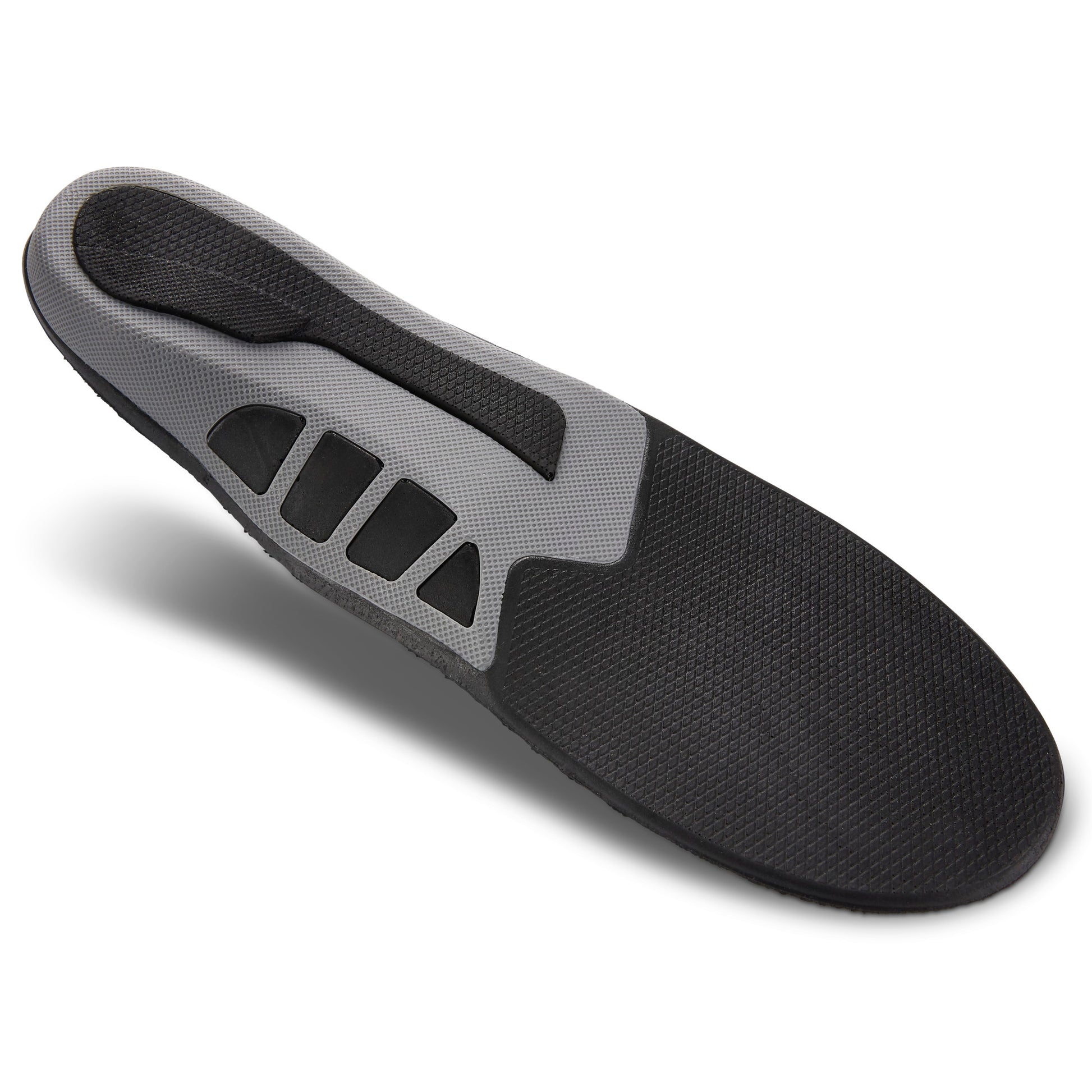 Shoe insert stabilizes foot on a white background.