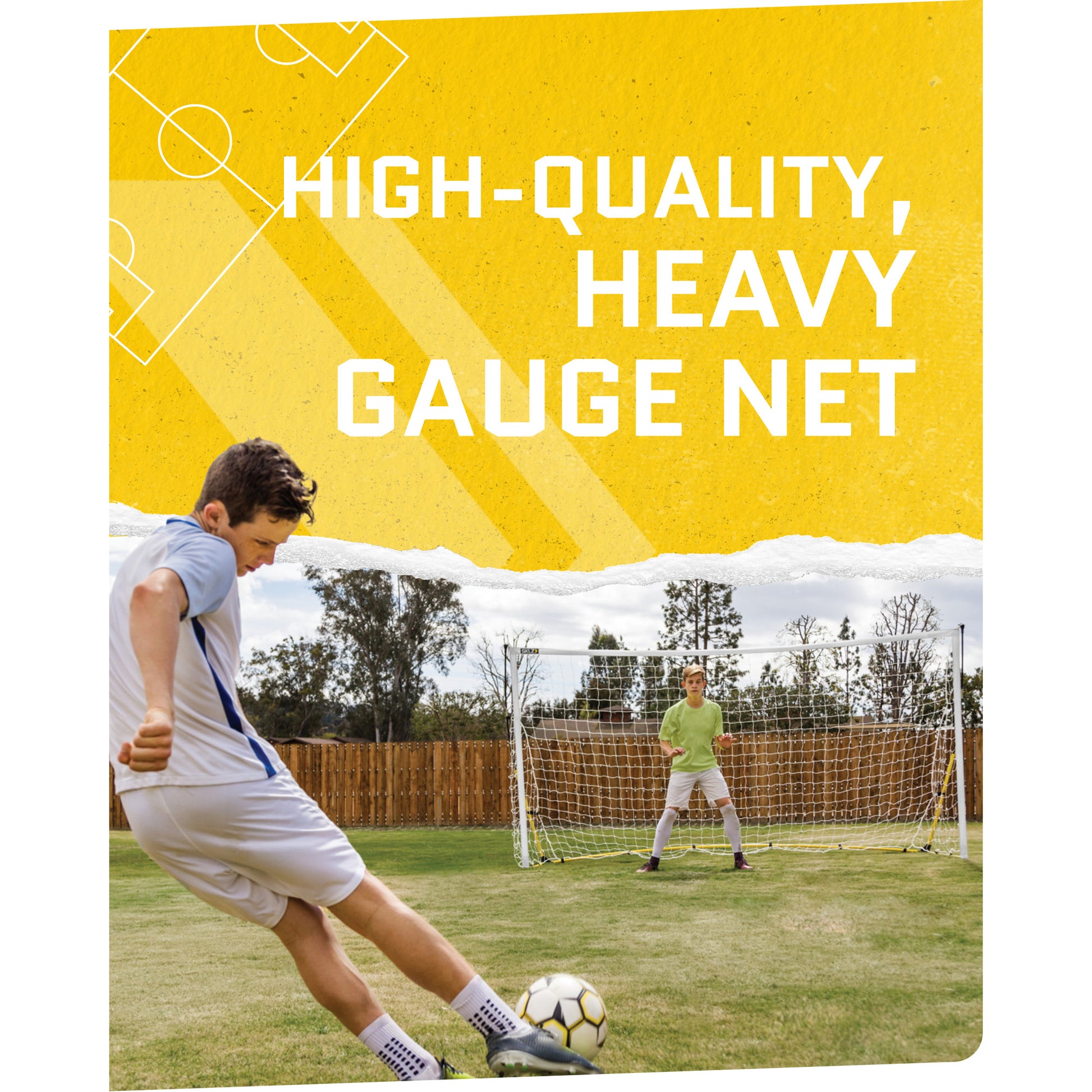 A person kicks a soccer ball towards a goalkeeper in front of a heavy gauge net in a yard