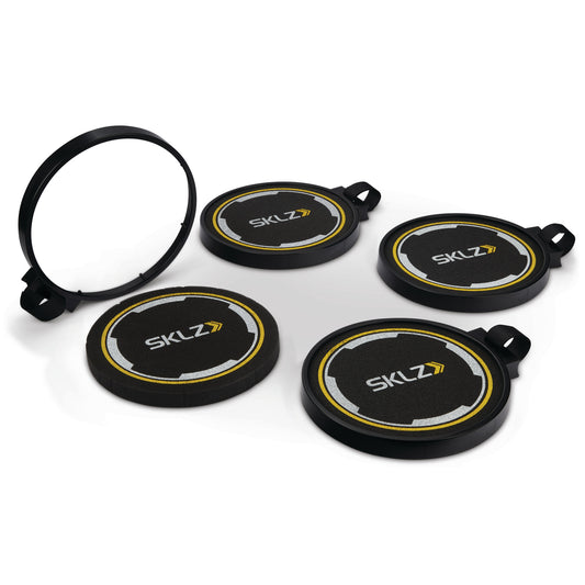 The set of four indexed ski pole guards is arranged on a white surface with a spare part in the background