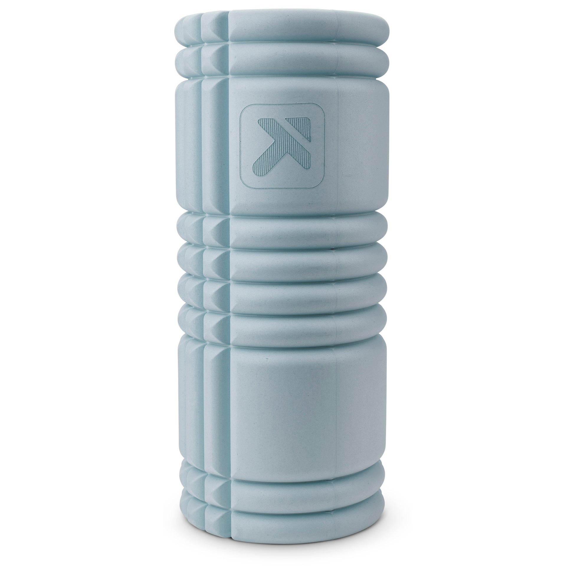 A light gray foam roller rests upright against a plain white background