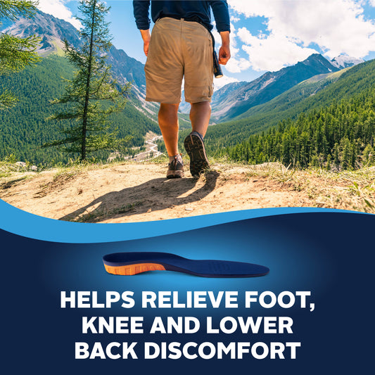 A hiker walks along a mountain trail with green forests and blue sky in the background, promoting foot relief shoes.