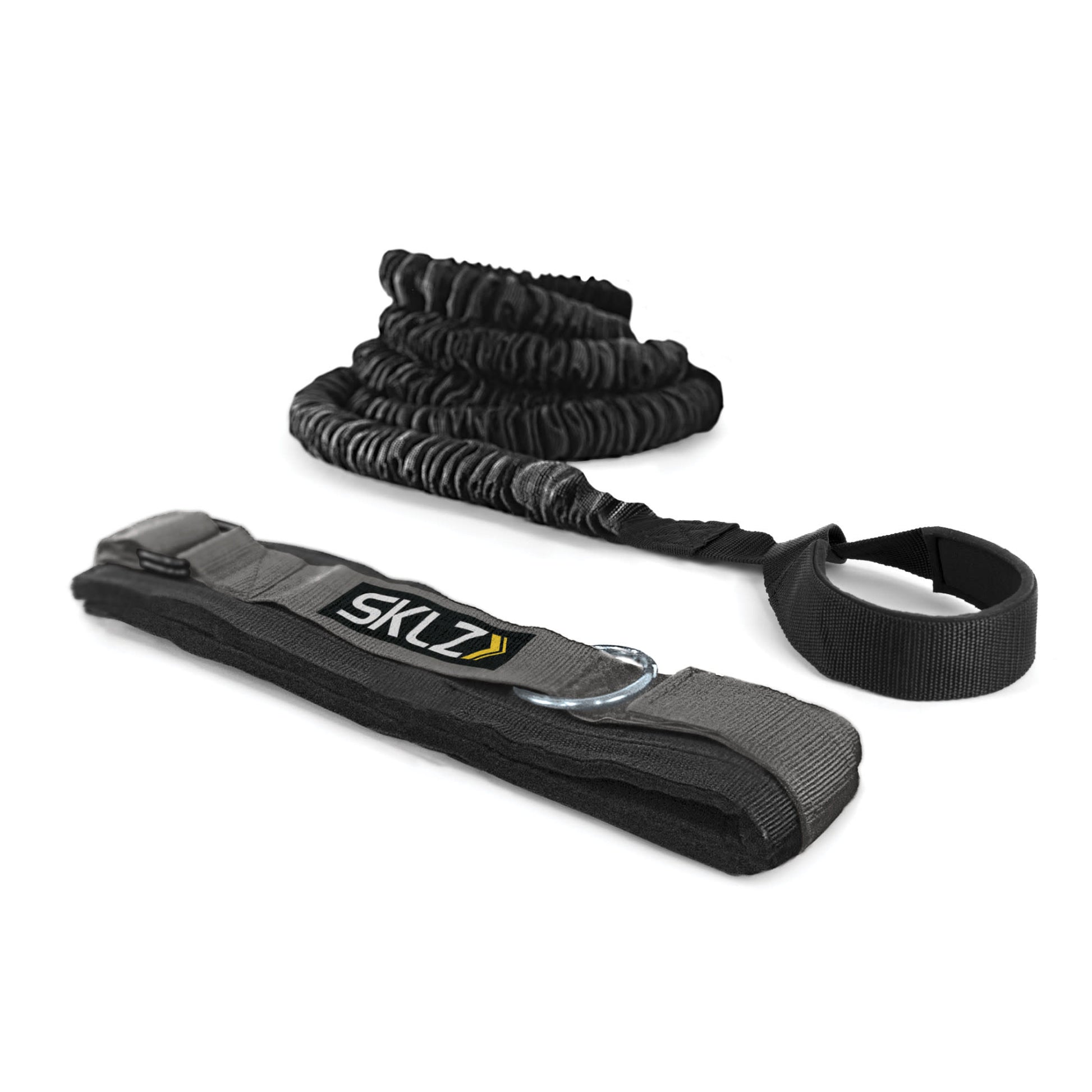 A ski strap and a traction belt are laid out for securing skis and providing grip on snow.