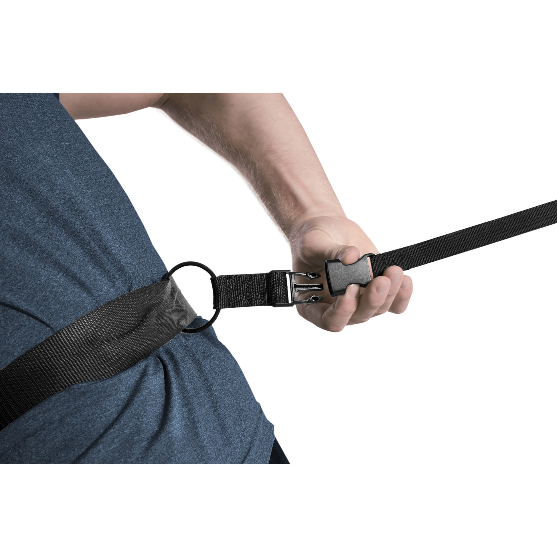 Person pulls on a strap attached to their safety harness in a controlled environment