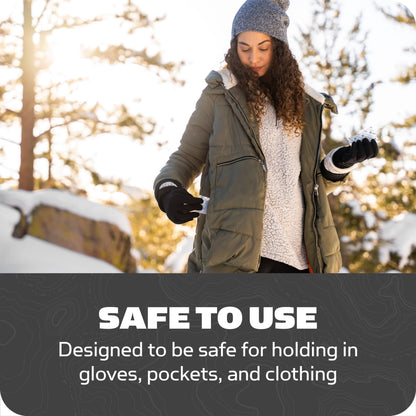 Woman outdoors checks gloves in winter environment at sunrise or sunset
