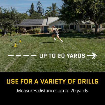 Woman runs with a football on a lawn near a house and trees