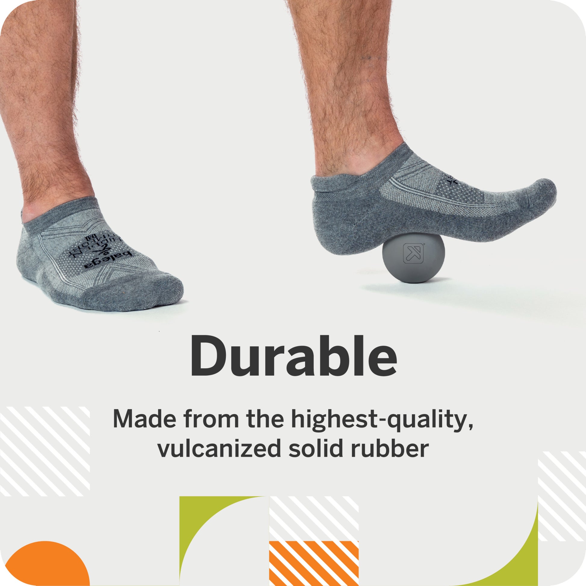 A foot rolls on a rubber ball for massaging purposes in a fitness or therapy setting.