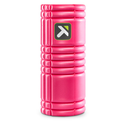 A pink foam roller supports exercises in a fitness environment.