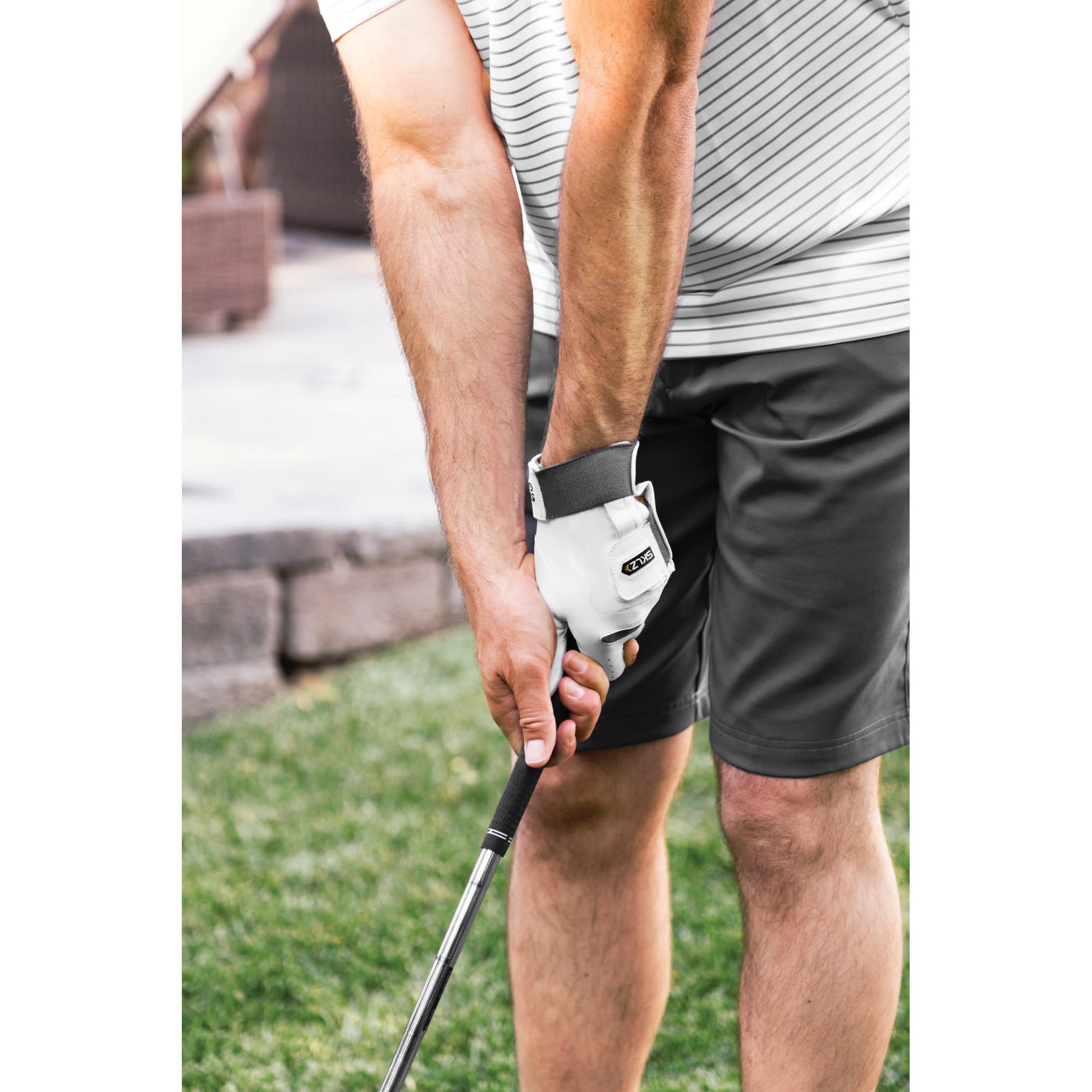Golfer prepares to swing on a golf course during daytime