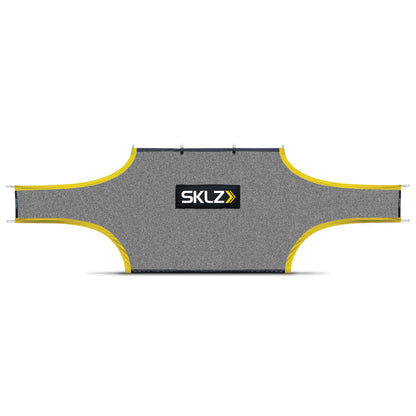 The inflatable ski jump inflates on a flat surface with a SKLZ logo in the center
