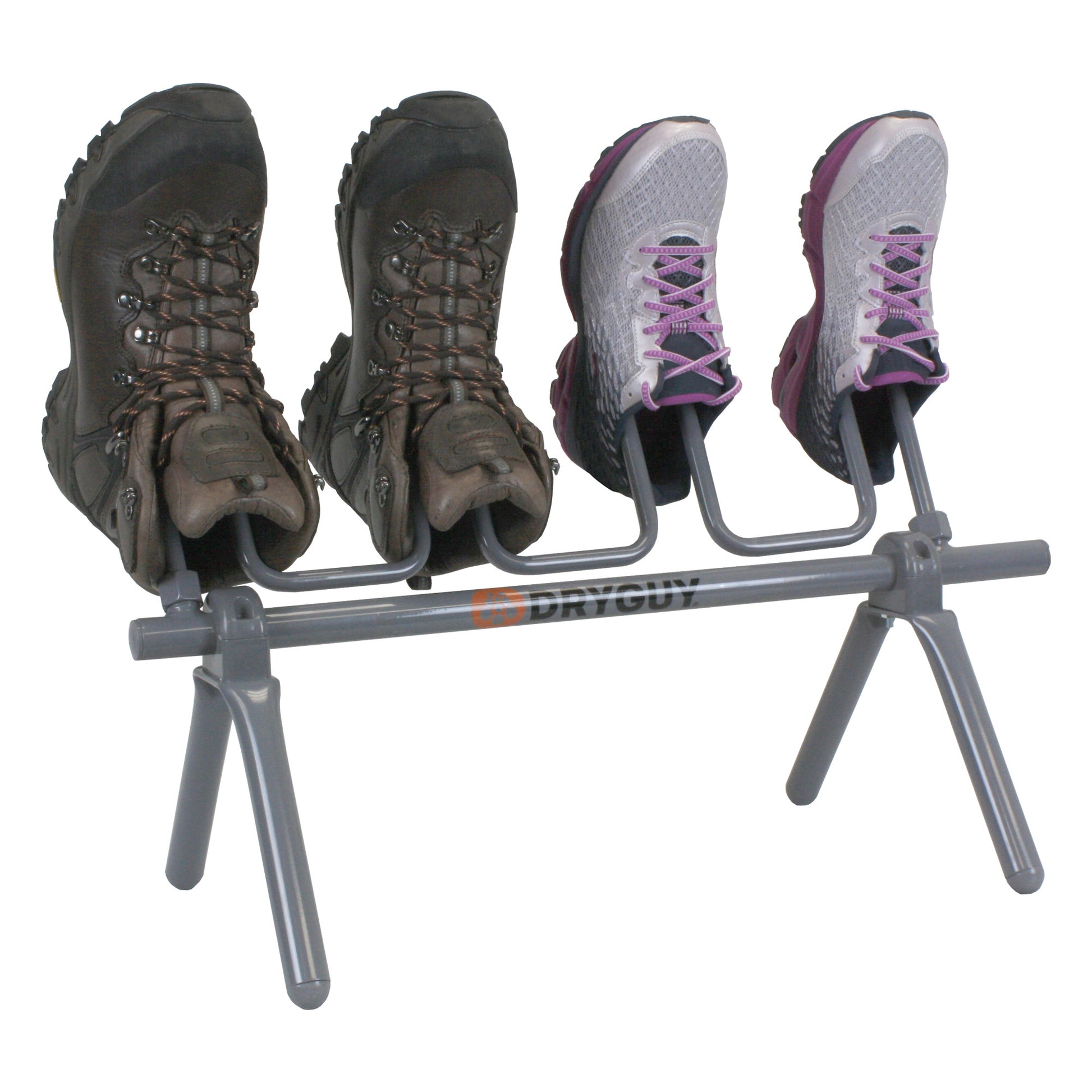 Boots and sneakers are drying on a two-tier rack in a laundry or drying area.