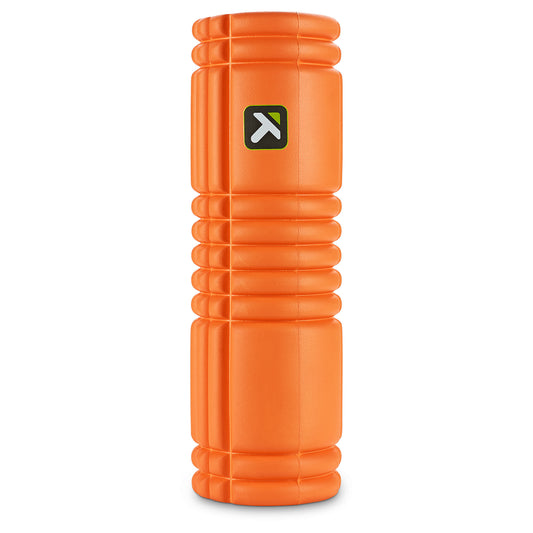 Foam roller rolls on gym floor for exercise and muscle recovery.