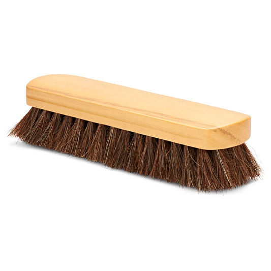 The scrubbing brush cleans surfaces in cleaning supplies area