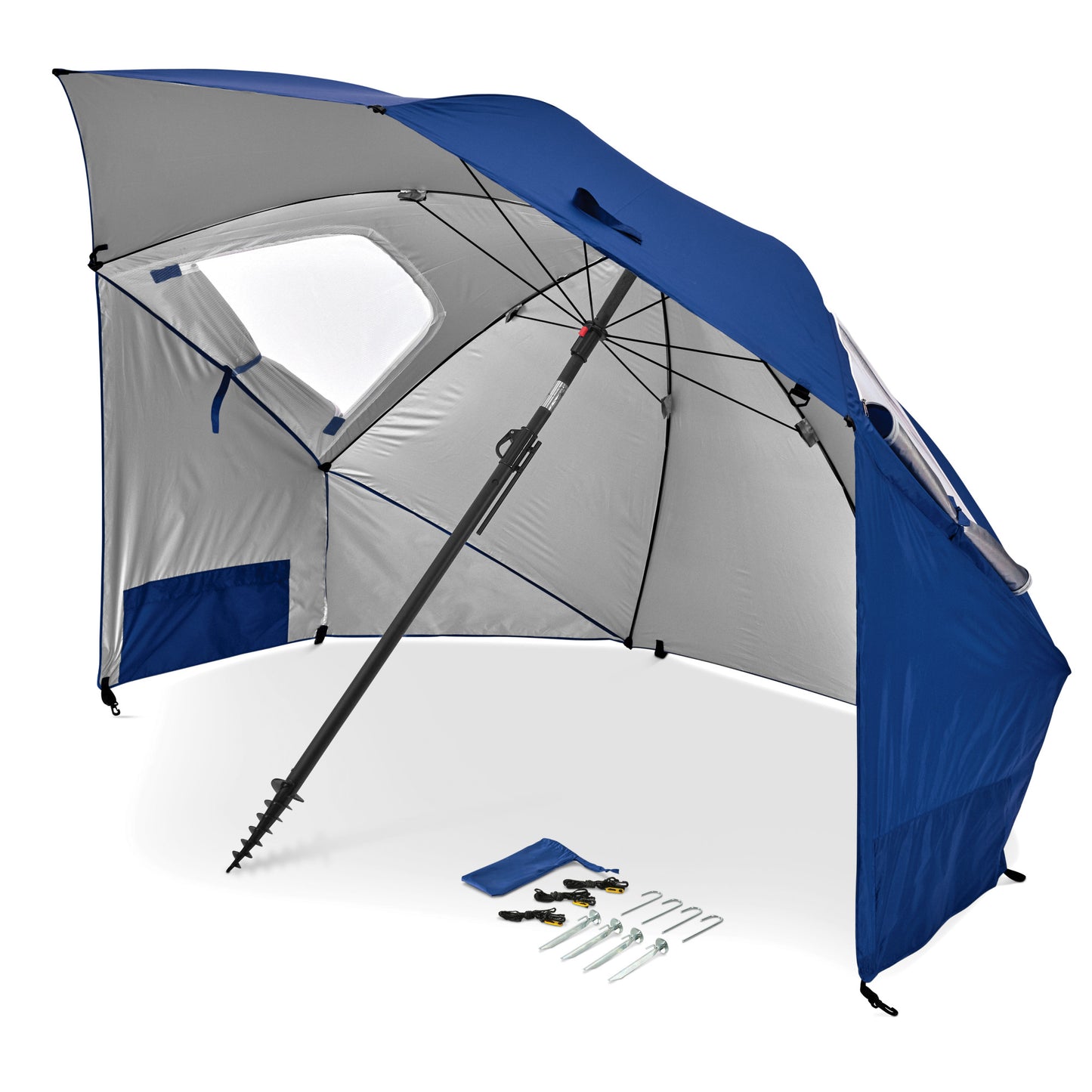 A large outdoor umbrella is set up with various tools and accessories beneath it.