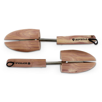 Wooden snow shovels are arranged parallel on a white background for display.