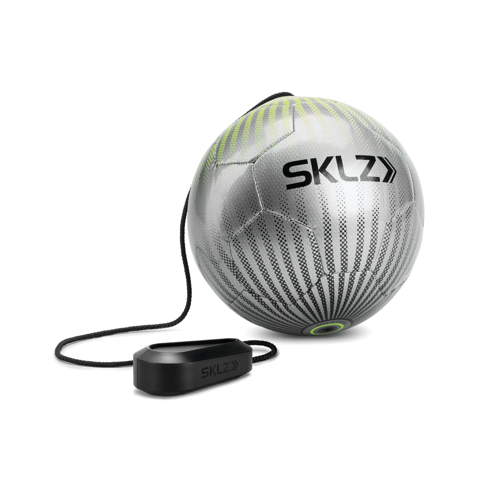 A silver SKLZ medicine ball with a connected black device for training or exercise use