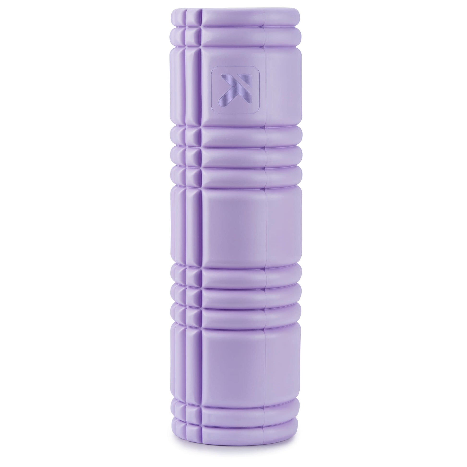 A purple foam roller is used for exercise on a white background.