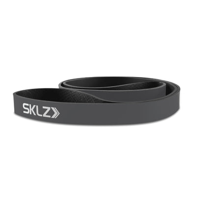 A black resistance band with SKLZ logo resting on a white background