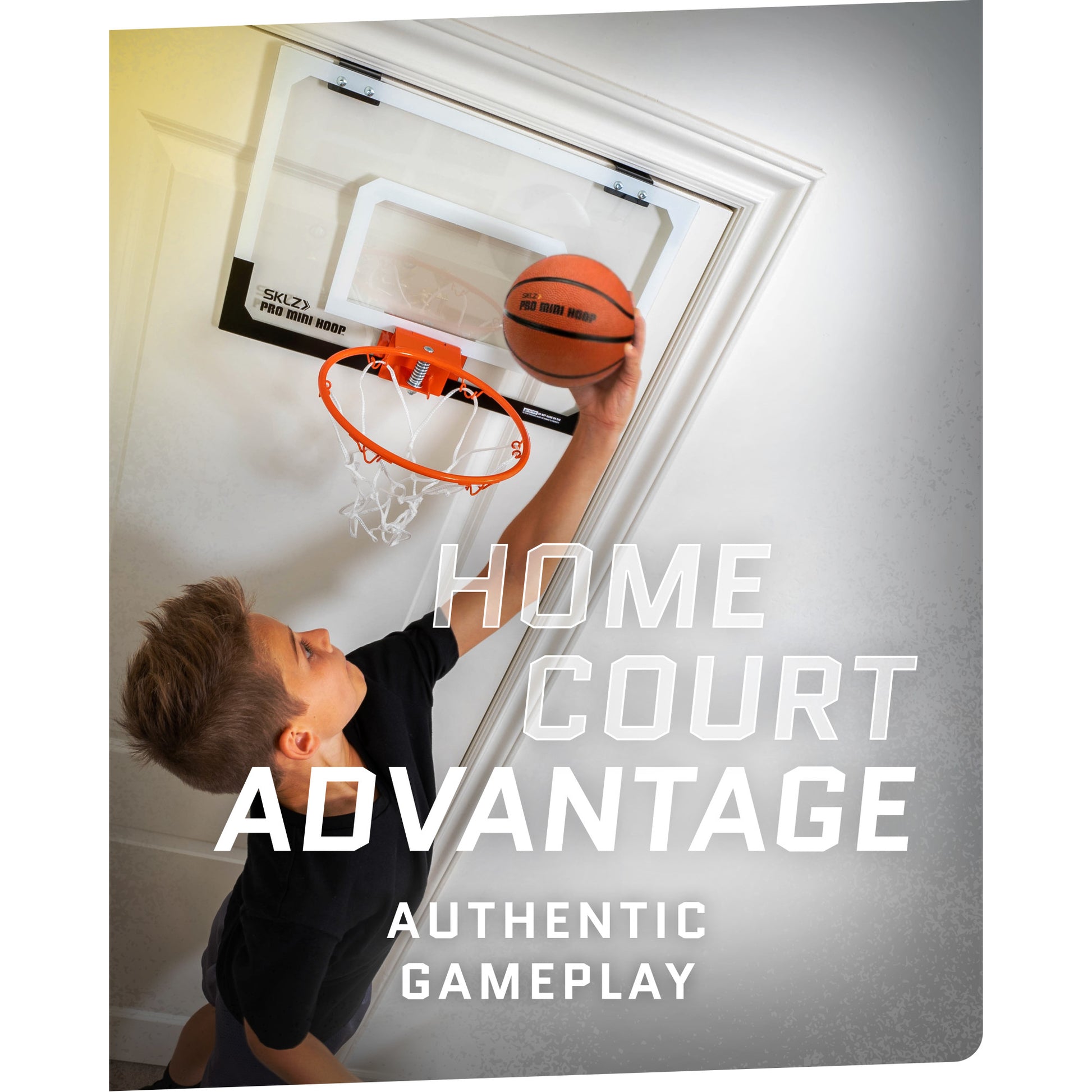 Boy dunking a basketball into a hoop on a door promoting home court advantage gaming