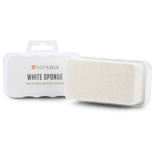 A white sponge cleans shoes inside a plastic case in a retail display.