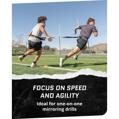 Two runners train with resistance bands on a track during daylight for speed and agility