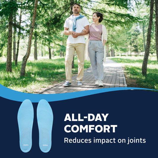 Two people walk arm-in-arm on a park path, promoting comfortable insoles that ease joint impact.