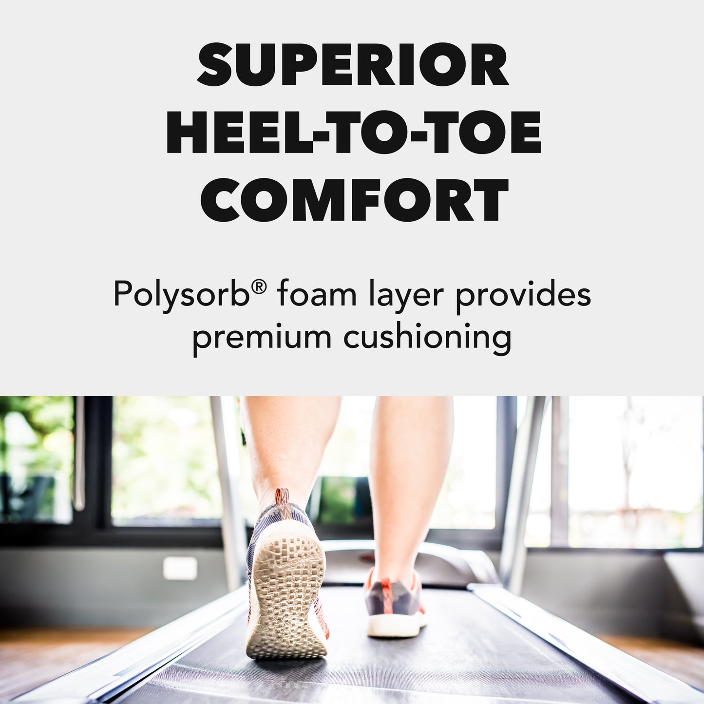 A person walks on a treadmill with cushioned shoes in a gym environment.