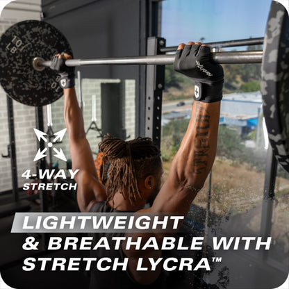 Person lifts barbell in gym using lightweight stretch lycra gloves for grip and comfort.