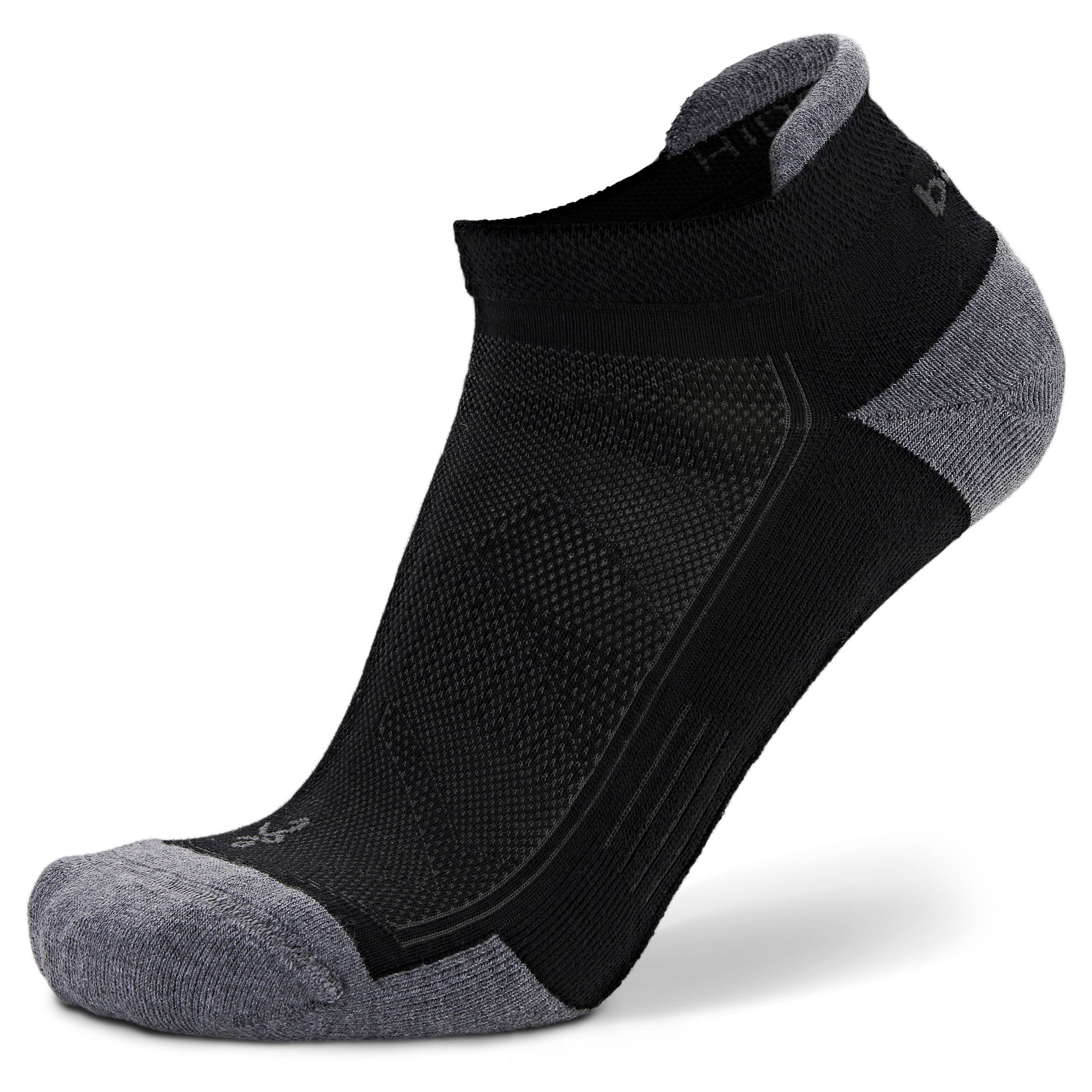 Athletic ankle sock maintains comfort during sports activities on a plain white background.