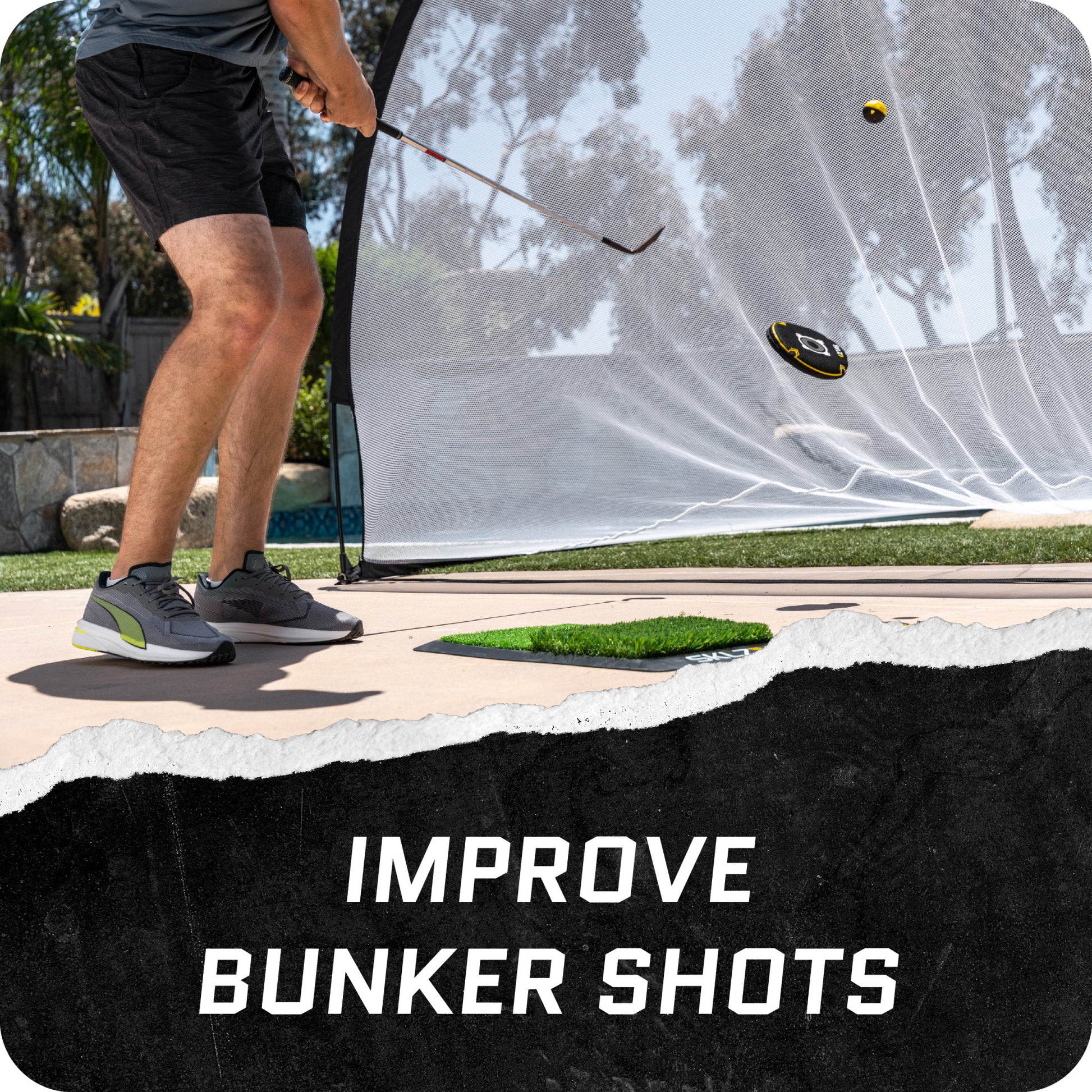 Golfer hits ball from bunker beside a net with the text improve bunker shots