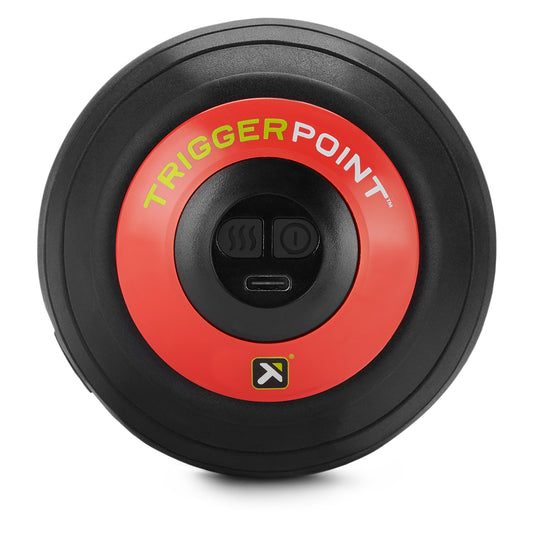 Trigger point device activates heat and vibration in a gym environment.