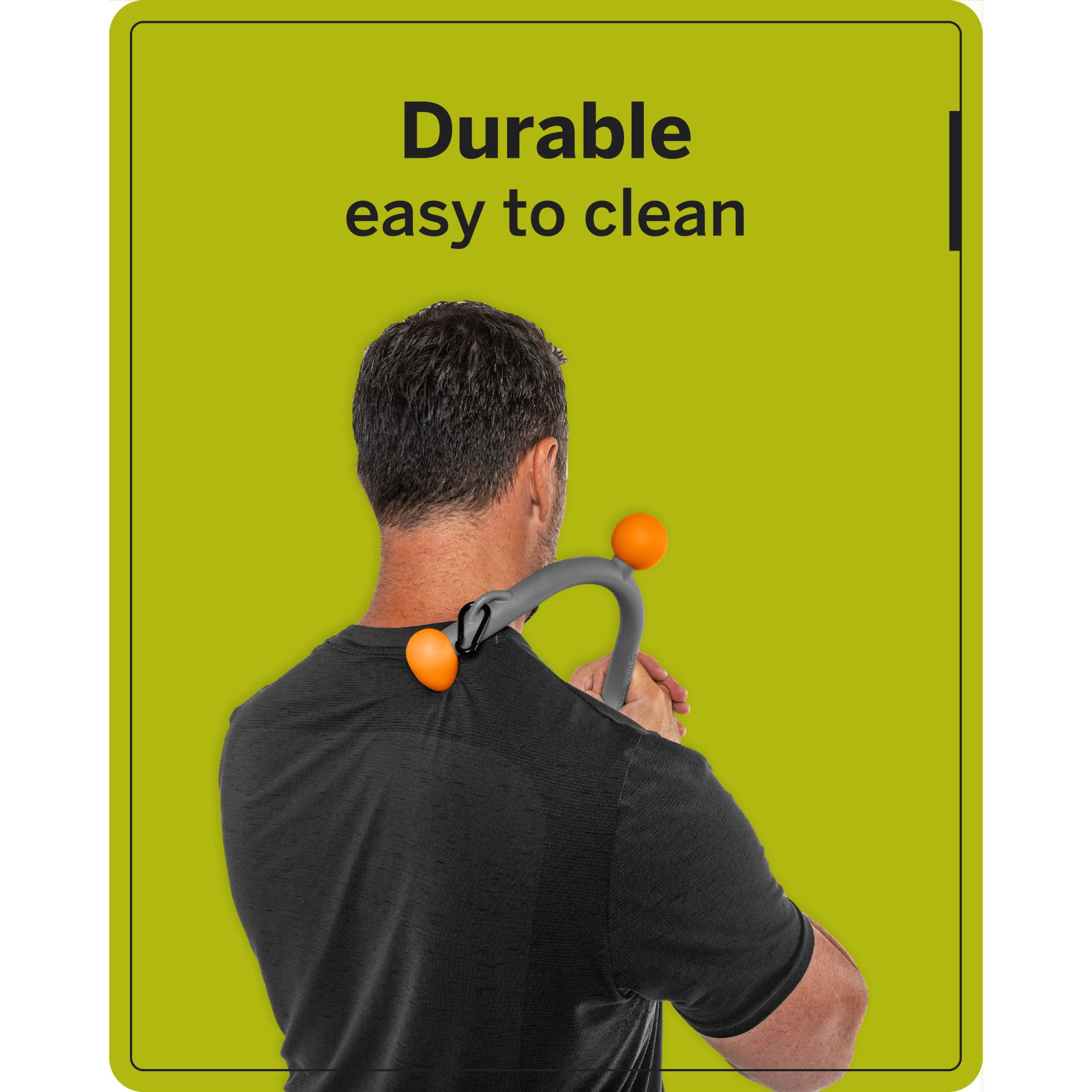 Man uses a durable back massager against his shoulder in front of a green background.