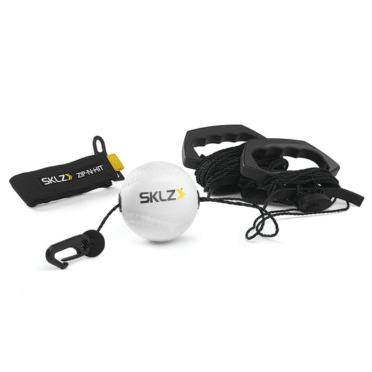 A SKLZ resistance training set with a tether ball ankle strap and handles on a white background