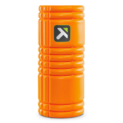 TriggerPoint GRID 1.0 foam roller in orange standing upright with logo
