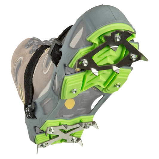 Shoe sole features hiking crampons attached for traction on icy terrain.