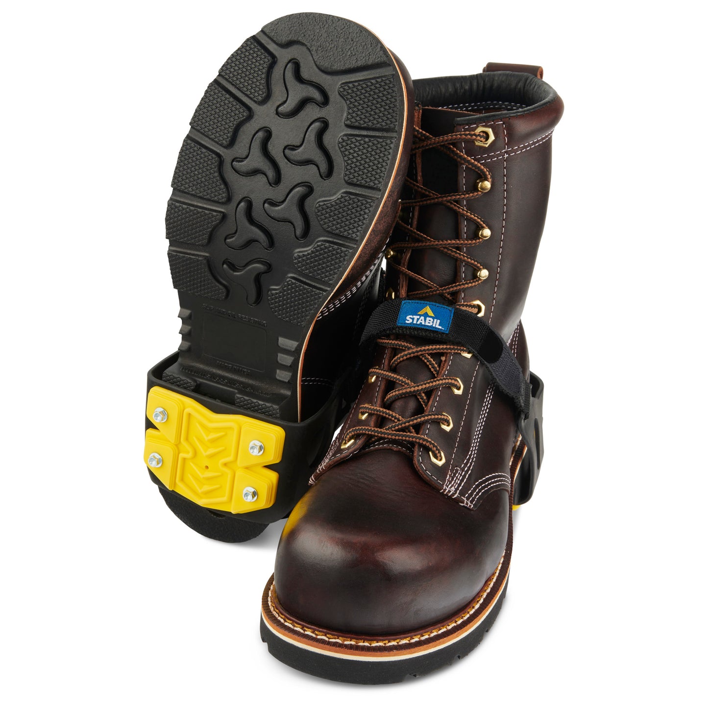 Pair of work boots with sturdy soles in a workspace setting