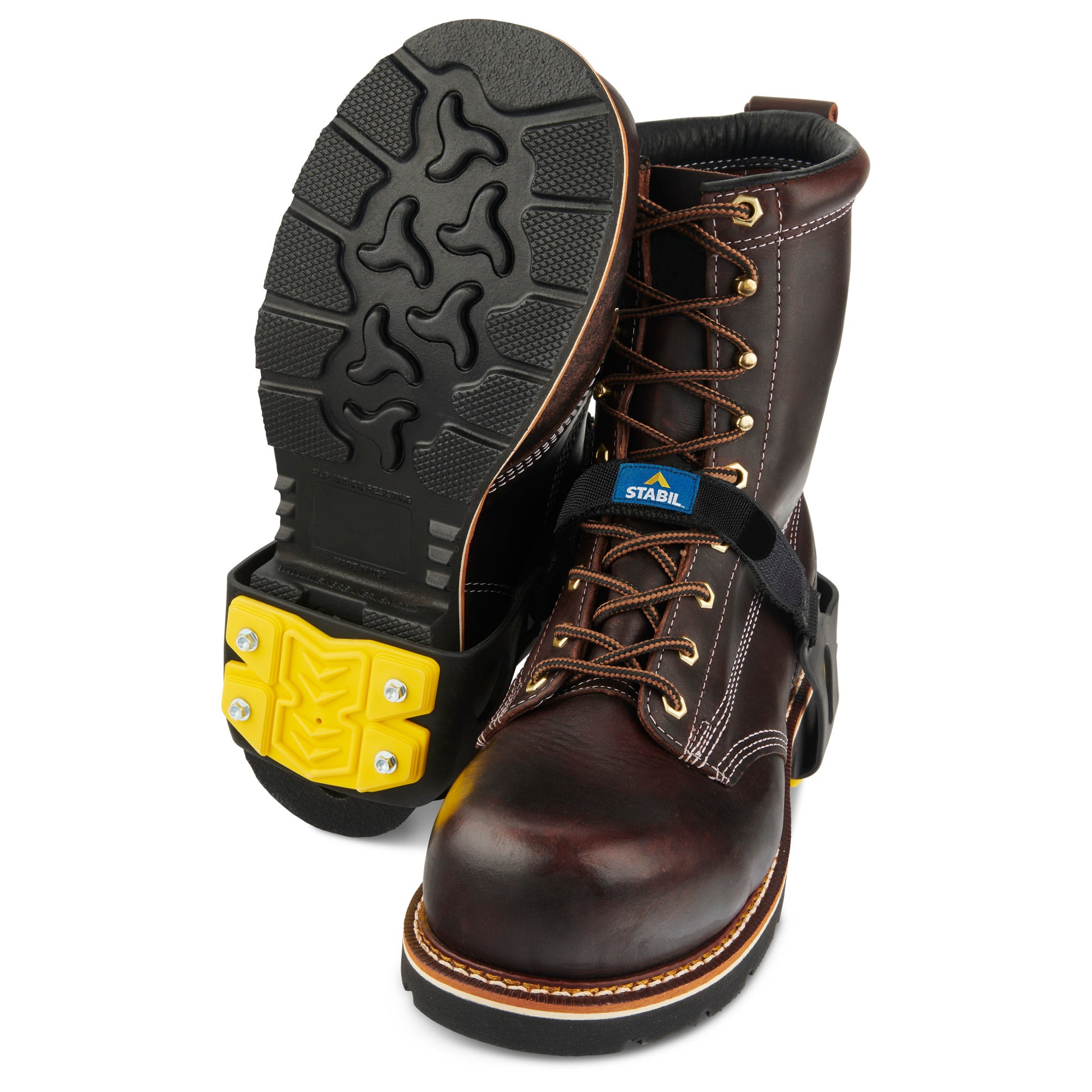 Pair of work boots with sturdy soles in a workspace setting