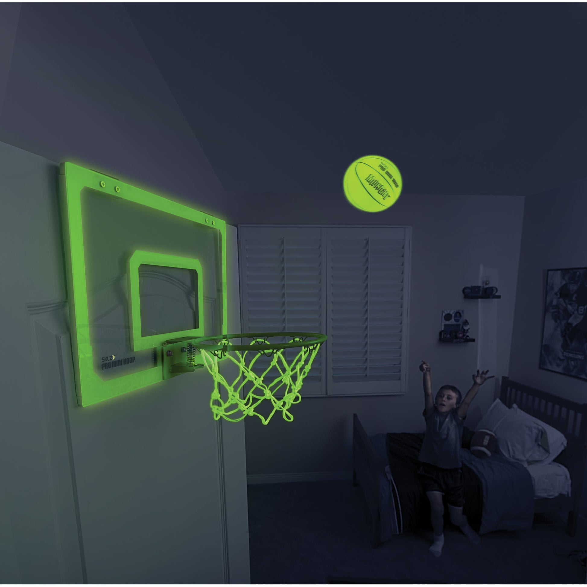 Child shoots a ball towards a glowing basketball hoop in a bedroom